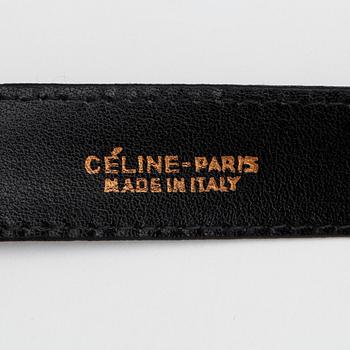 CÉLINE, a black lacquer leather belt.