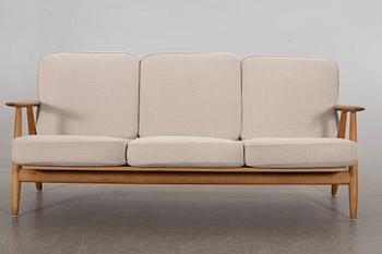 HANS J WEGNER, a Cigarren oka sofa Getama möbler Denmark later part of the 20th century.