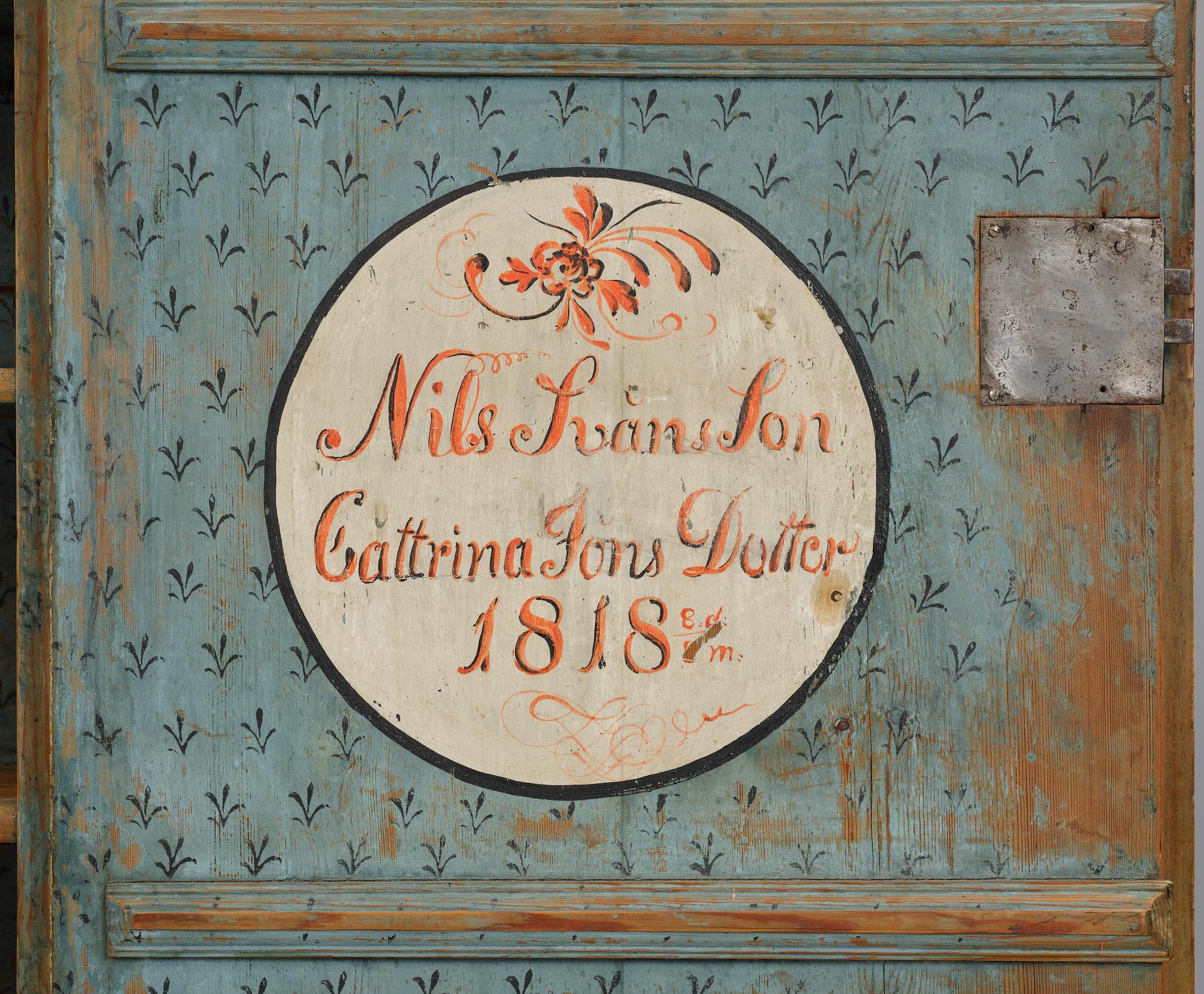 A polychrome-painted folk art cabinet from Värmland, Sweden, dated 1818.