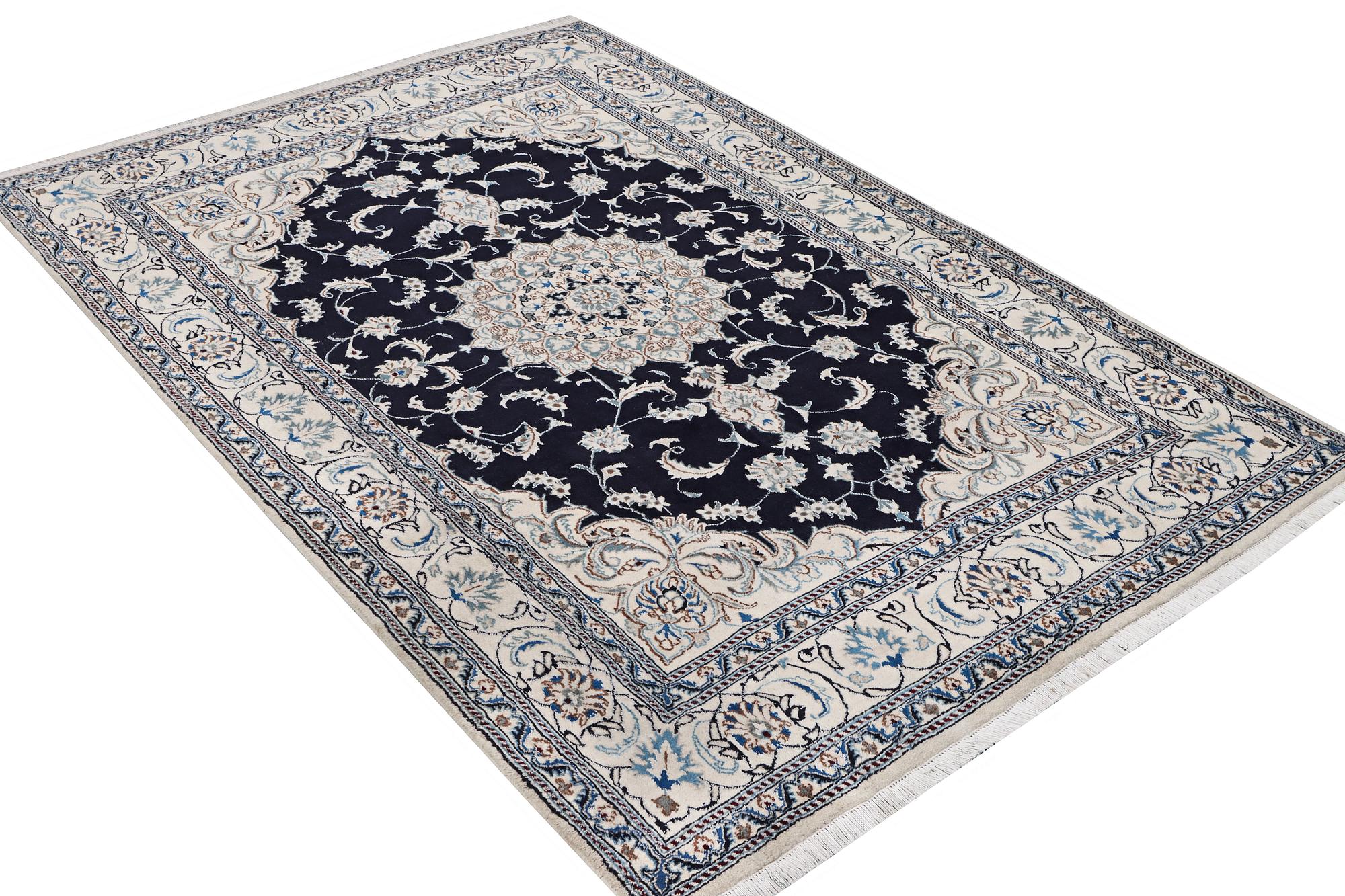 A Nain carpet, part silk, c. 303 x 200 cm.