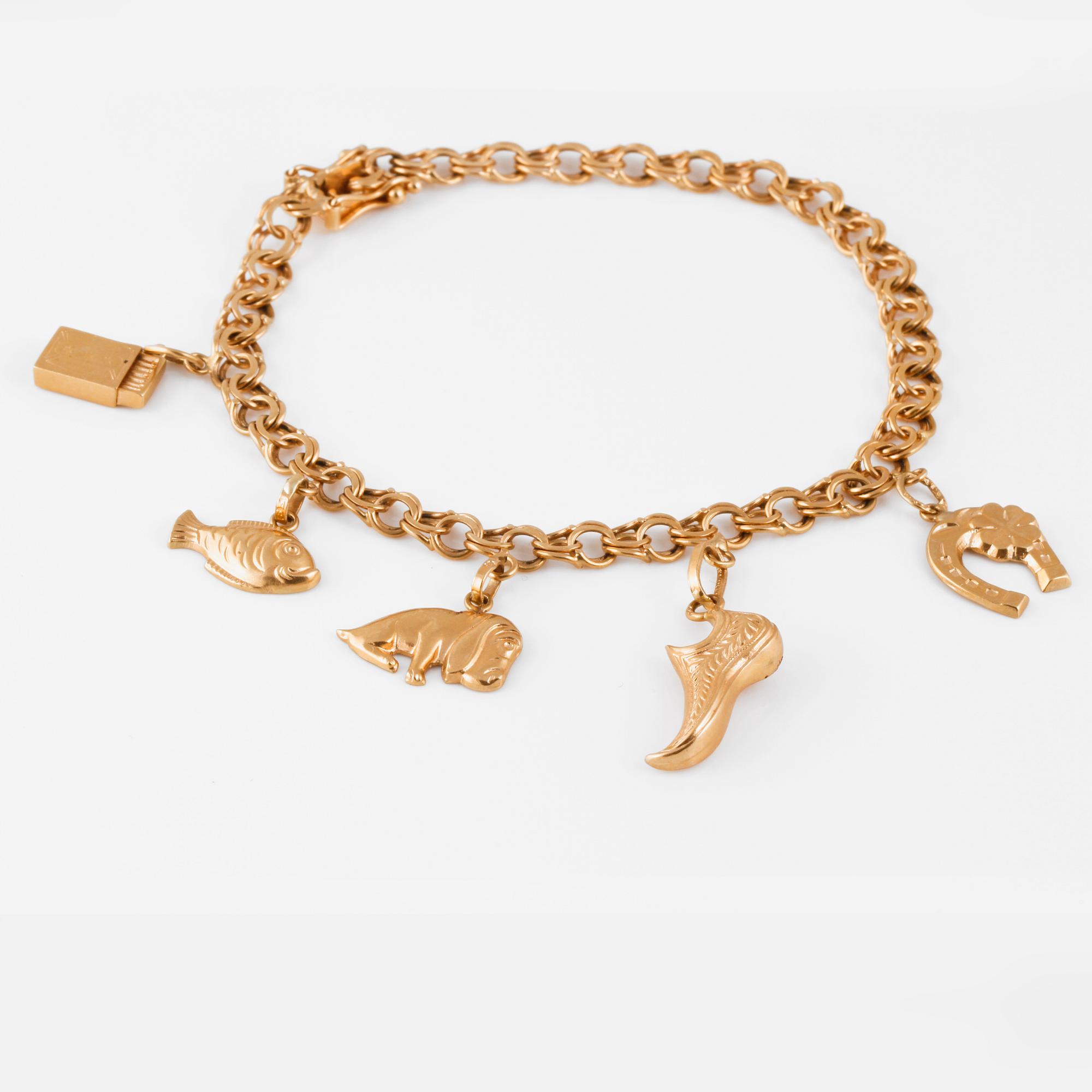ARMBAND med 4 BERLOCKER, 18K guld, Mary Kvoch, Stockholm, 1959. Vikt 10,7 gram.