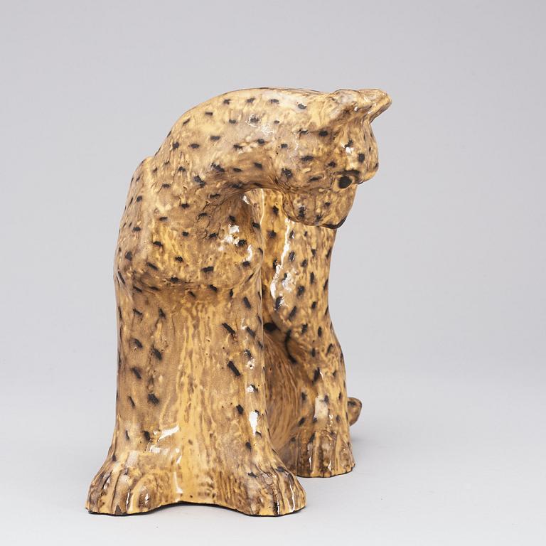 A Vicke Lindstrand yellow glazed ceramic figure of a cheetah, Upsala-Ekeby 1949, model 3003.