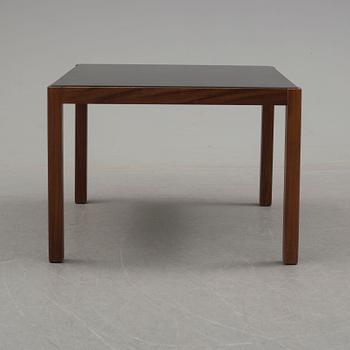 A 1960's teak coffee table with glass top.
