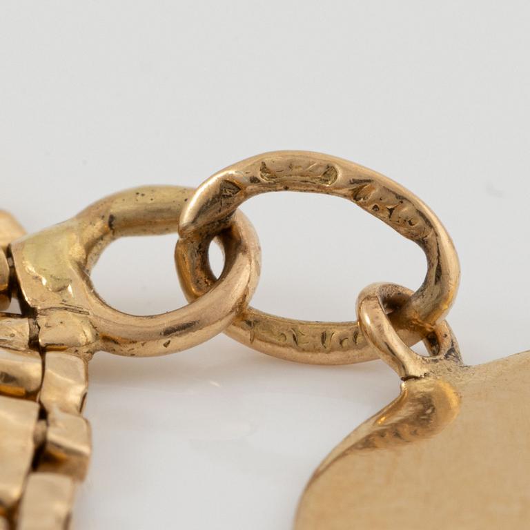 Armband med berlocker guld 18K guld.