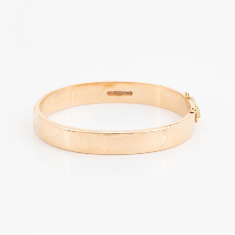 A 14K gold bracelet.