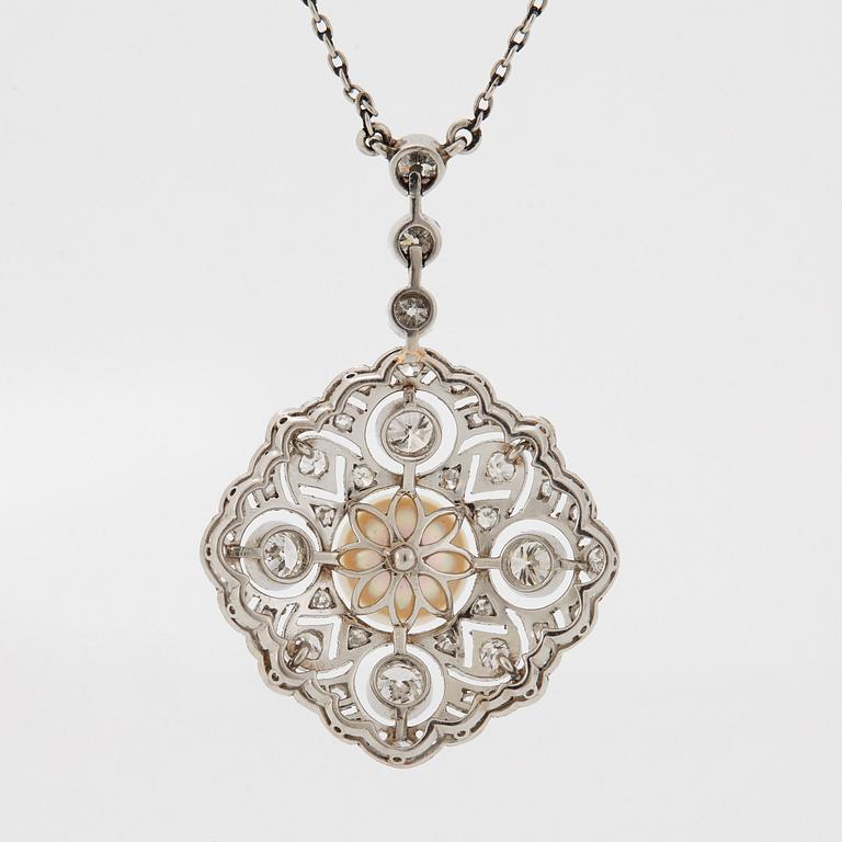 A platinum pendant set with a bouton pearl and old- and rose-cut diamonds.