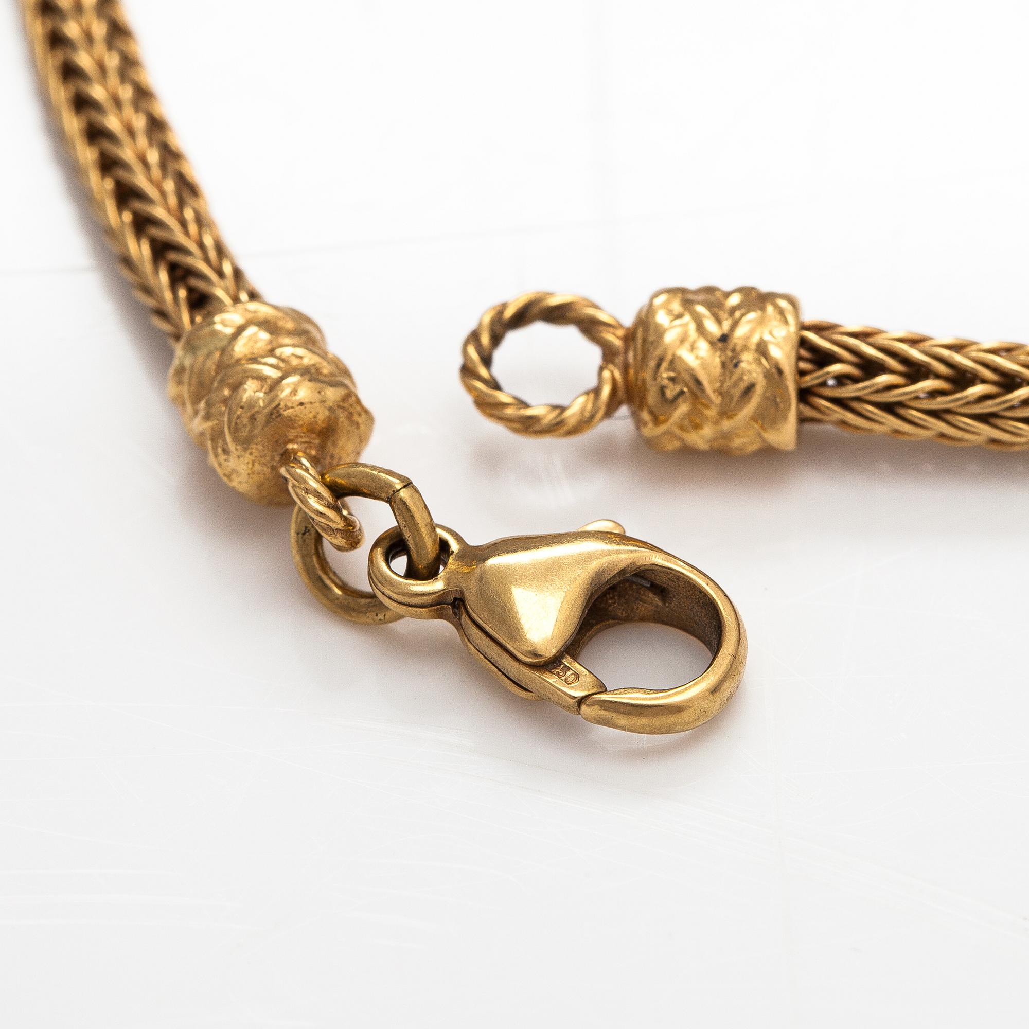 An 18K gold bracelet "Moose head". Kalevala Koru, Helsinki 1999.