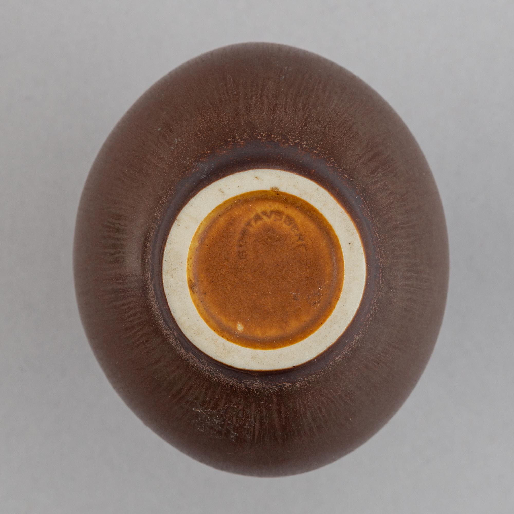 Stig Lindberg, a stoneware vase and a bowl and Berndt Friberg, a stoneware vase for Gustavsberg.