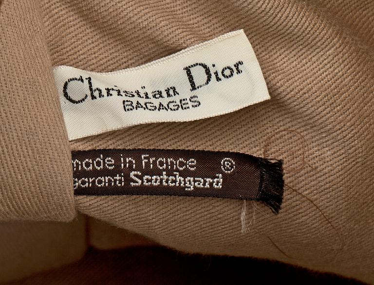 A monogram canvas weekendbag by Christian Dior.
