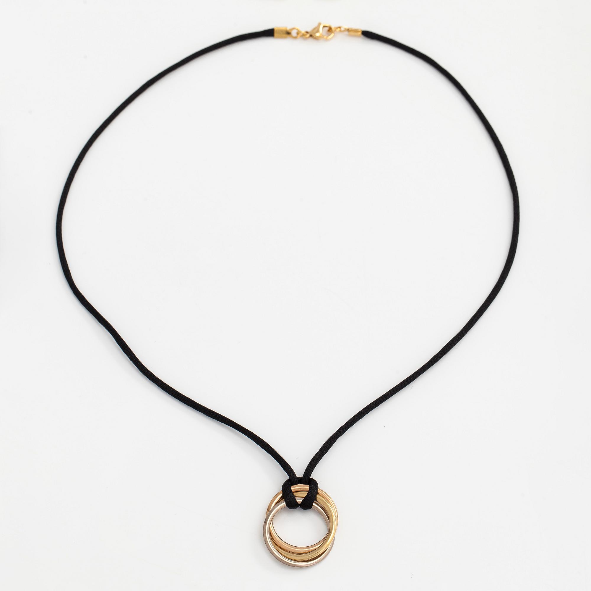 Cartier, necklace/pendant, "Trinity", 18K tricolour gold with black silk cord.