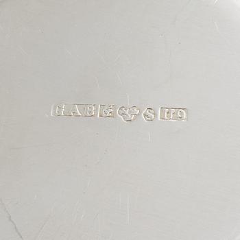 A set of eight parcel gilt Swedish silver vodka cups, bearing the mark of GAB, Stockholm, 1966-1970.
