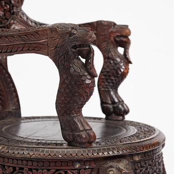 A pair of carved 'blackwood' armchairs, Bombay presidency, British Raj, circa 1880.