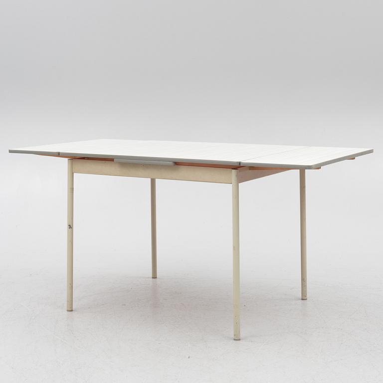 A table and four chairs, mid-20th Century.