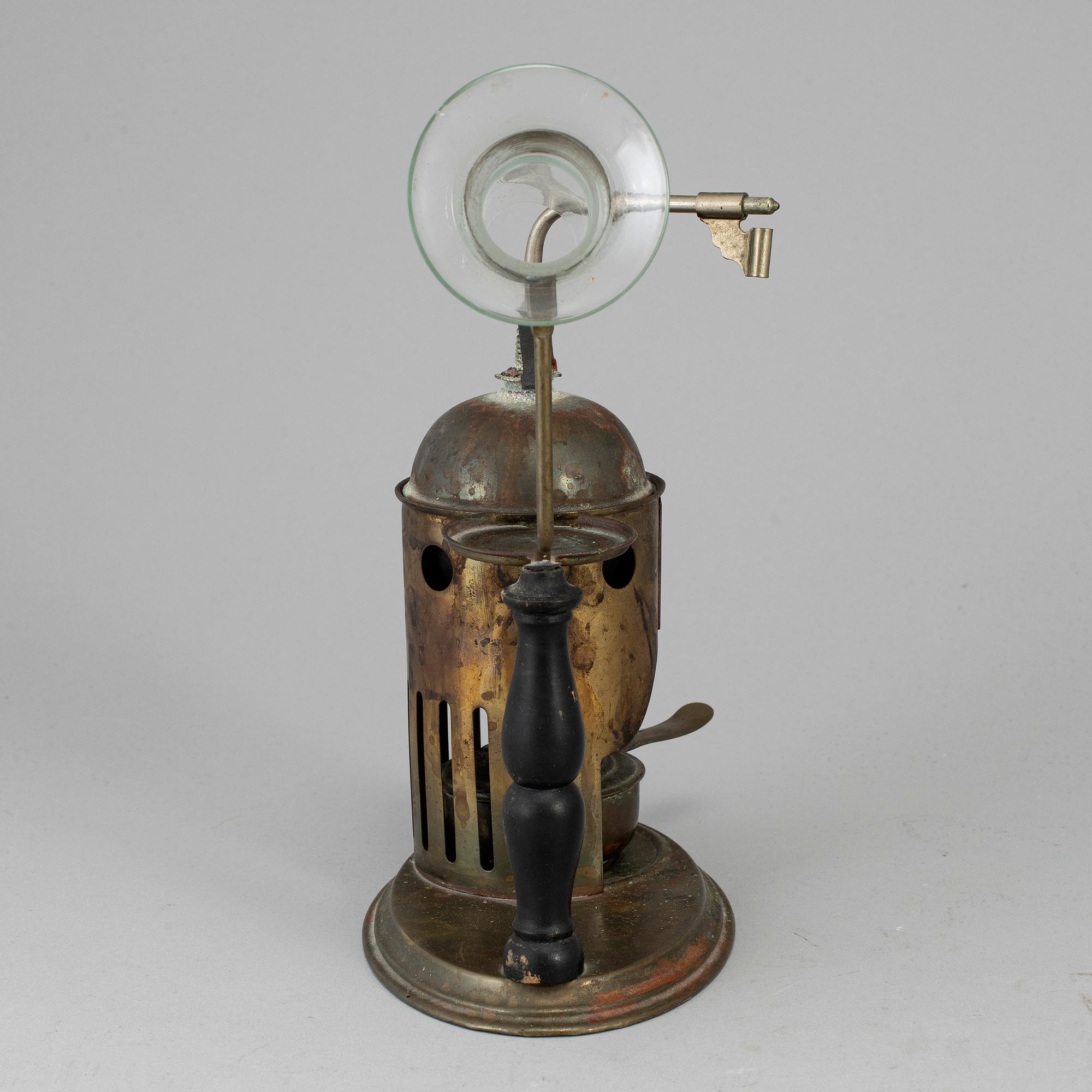 A tinplate burner, 20th century.