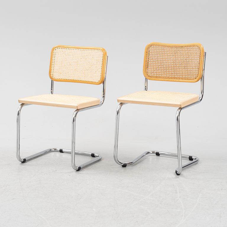 A set of five steel and rattan chairs from the late 20th century.