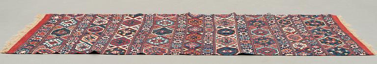 A CARPET, AN ANTIQUE AZERI KILIM, probably a Shirvan, ca 250 x 117,5 cm.