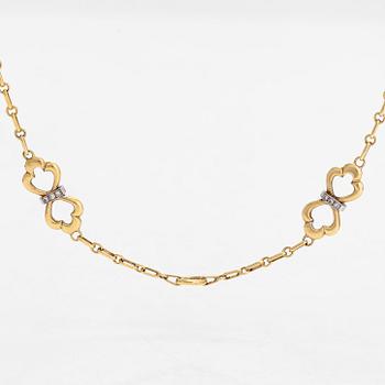 An 18K gold necklace, with diamonds totalling approx. 0.12 ct. Foreign hallmarks.