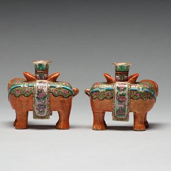 A pair of Canton candle sticks in the shape of elephants, Qing dynasty, 19th century.