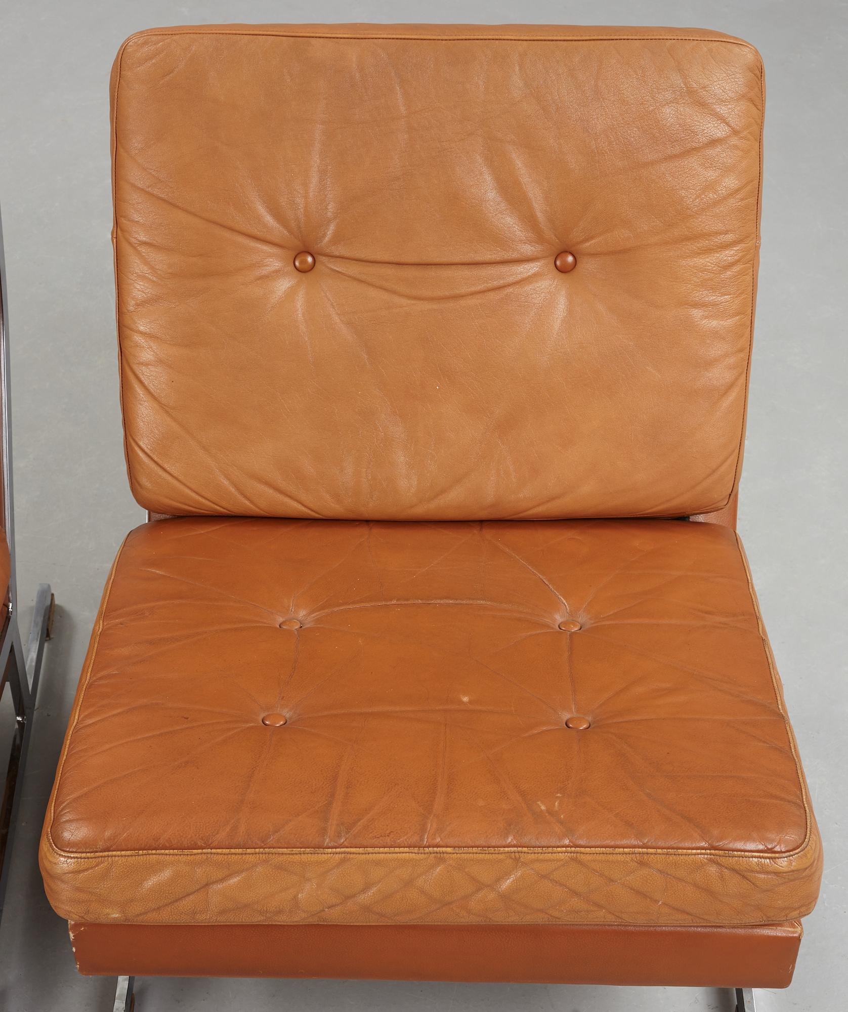 A pair of Poul Nørreklit chromed steel and brown leather easy chairs, Selectform, Denmark 1960's.