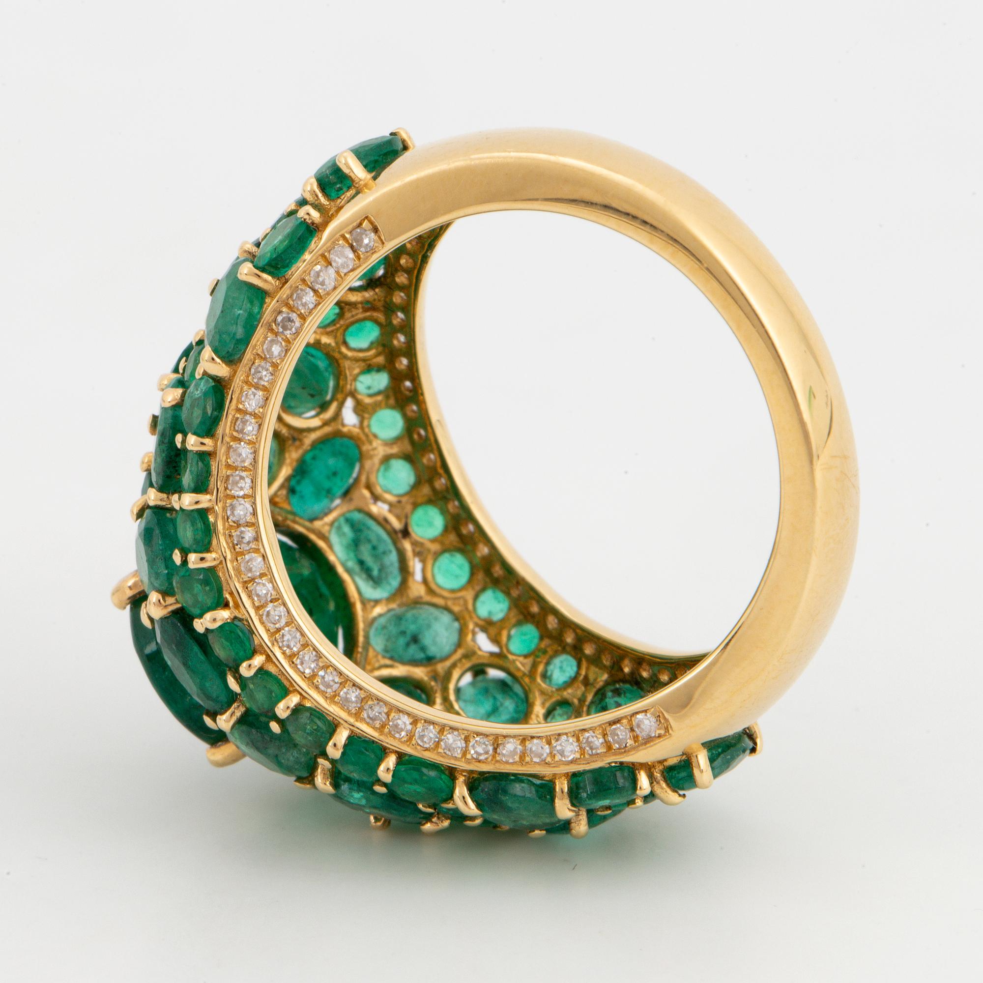 Emerald and brilliant-cut diamond ring.