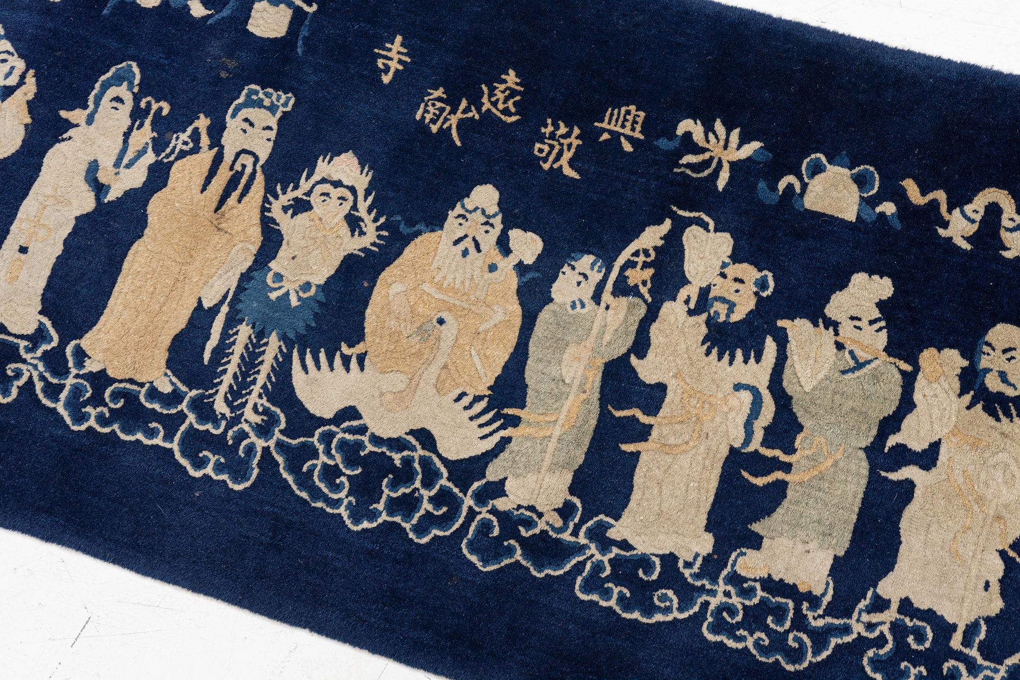 A Chinese 'immortals' carpet, Baotou, Measure: approx. 75 x 185 cm.