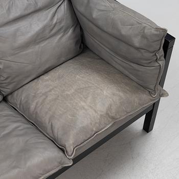 A lether sofa, later part of the 20th Century.
