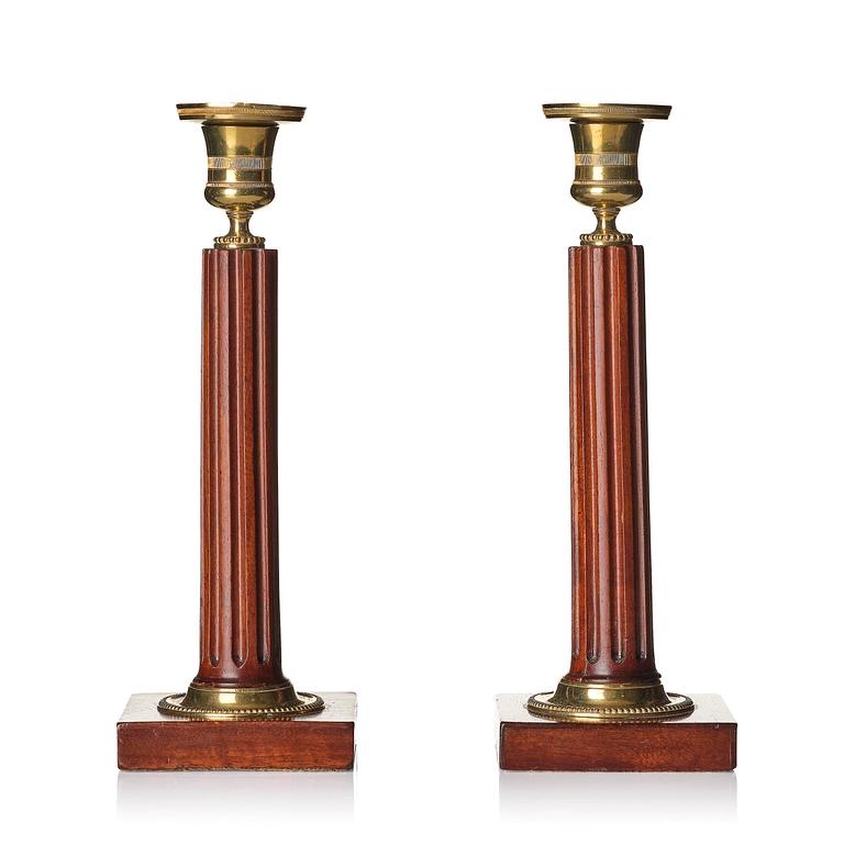 A pair of late Gustavian mahogany and gilt-brass candlesticks, late 18th century.