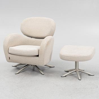 A 'Sting' swivel easy chair with stool, Brunstad, Norway.