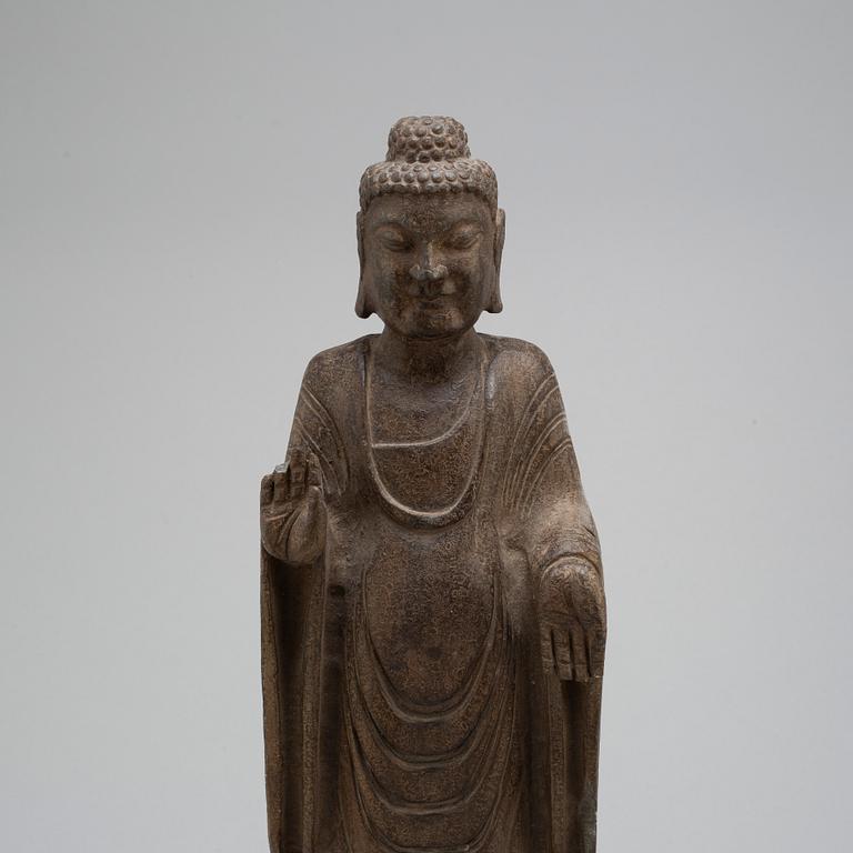 A stone sculpture of buddha,  South East Asia, 20th Century.