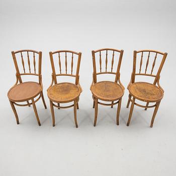 A set of four chairs from the first half of the 20th century.