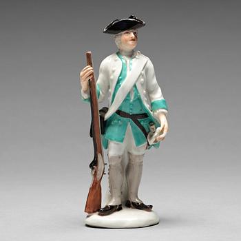 A German unmarked porcelain figure of a huntsman, 18/19th Century.