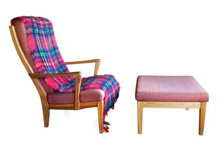 A PINE ARMCHAIR WITH OTTOMAN,
