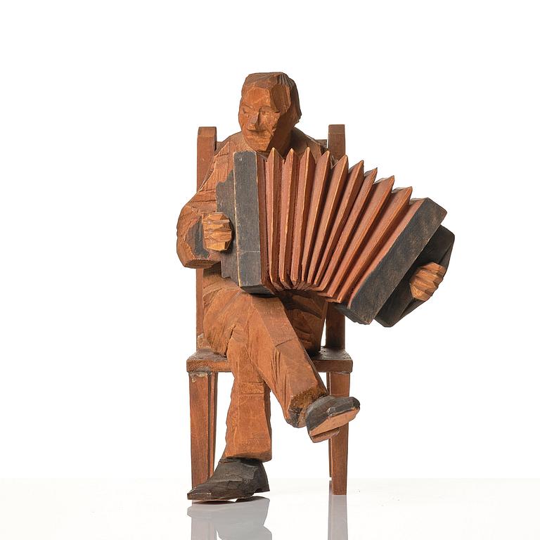 Axel Petersson Döderhultarn, Seated accordionist.