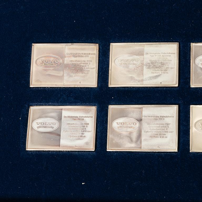 Plaketter, 12 st, silver, "De Historiska Volvobilarna 1927-1977", Franklin Mint.