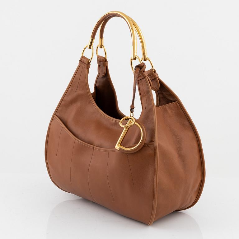 Christian Dior, a brown leather handbag.