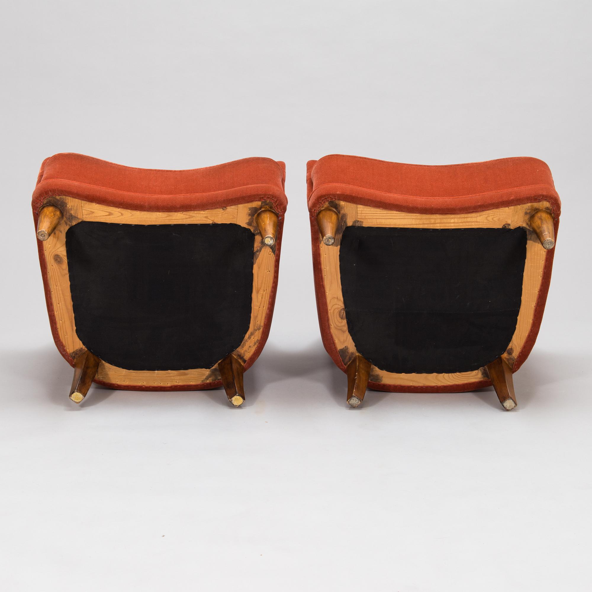 A pair of mid-20th-century armchairs.