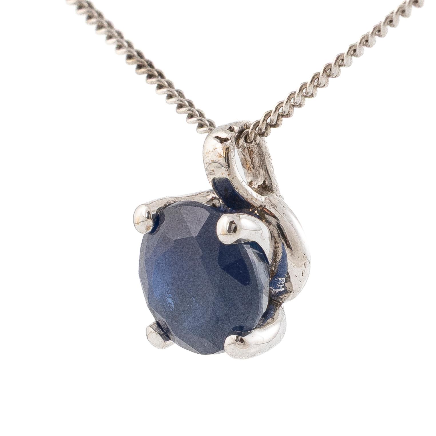 14K white gold necklace with a faceted sapphire.