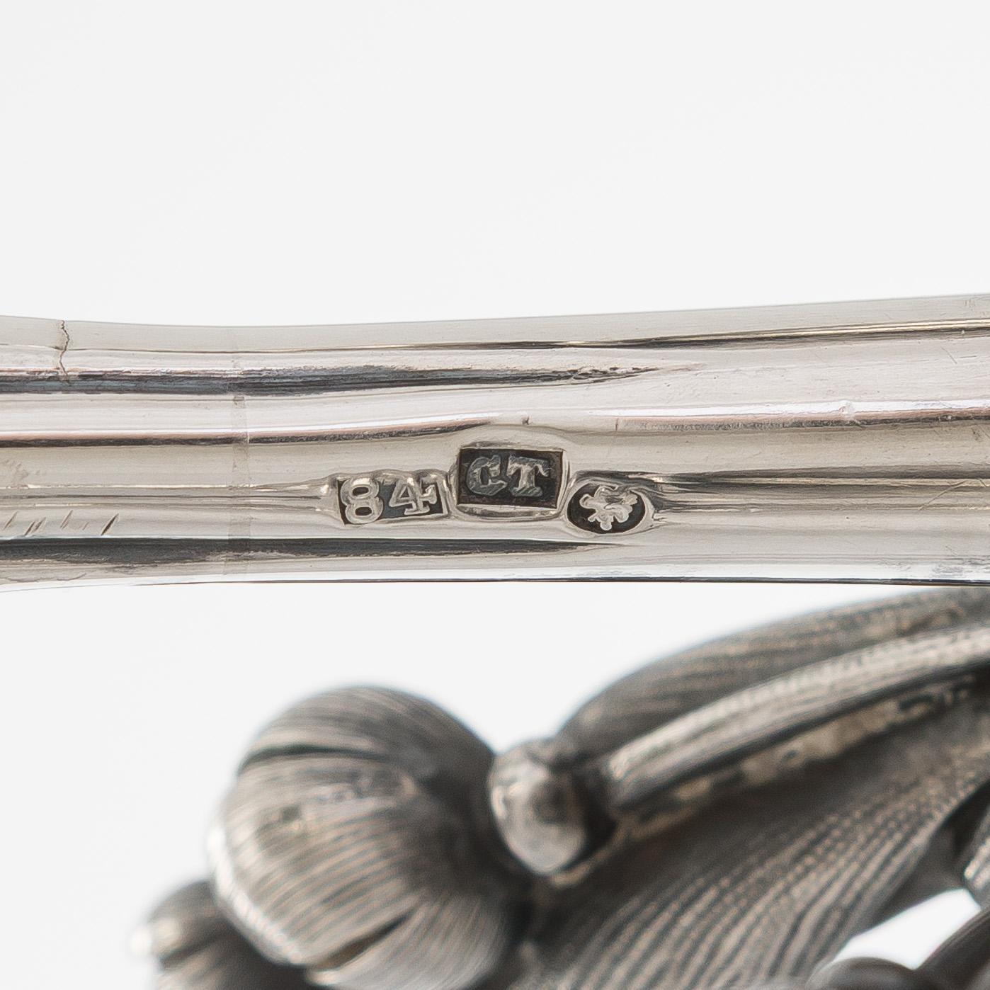 A pair of silver candelabra, maker marks of Carl Johan Tegelsten, Saint Petersburg 1850.