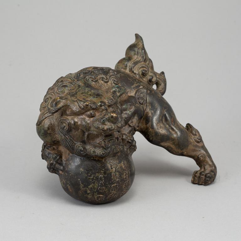 A bronze figure of a buddhist lion, Japan, 20th Century.