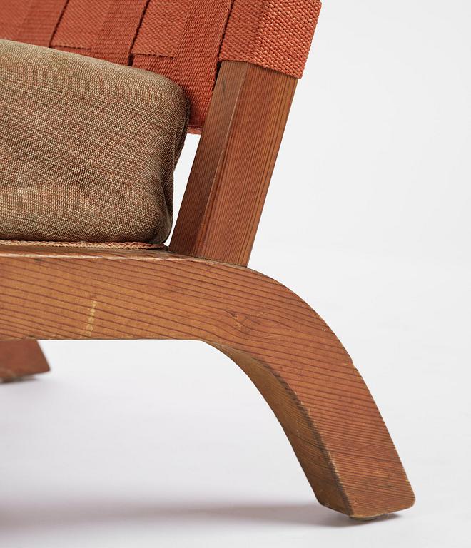 Axel Einar Hjorth, a pair of stained pine "Väddö" easy chairs, Nordiska Kompaniet, Sweden, 1930s-40s.