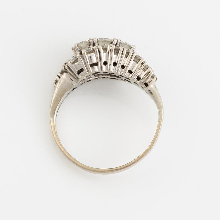 14K white gold and brilliant cut diamond ring.