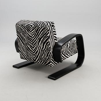 An armchair no 400, designed in 1936.