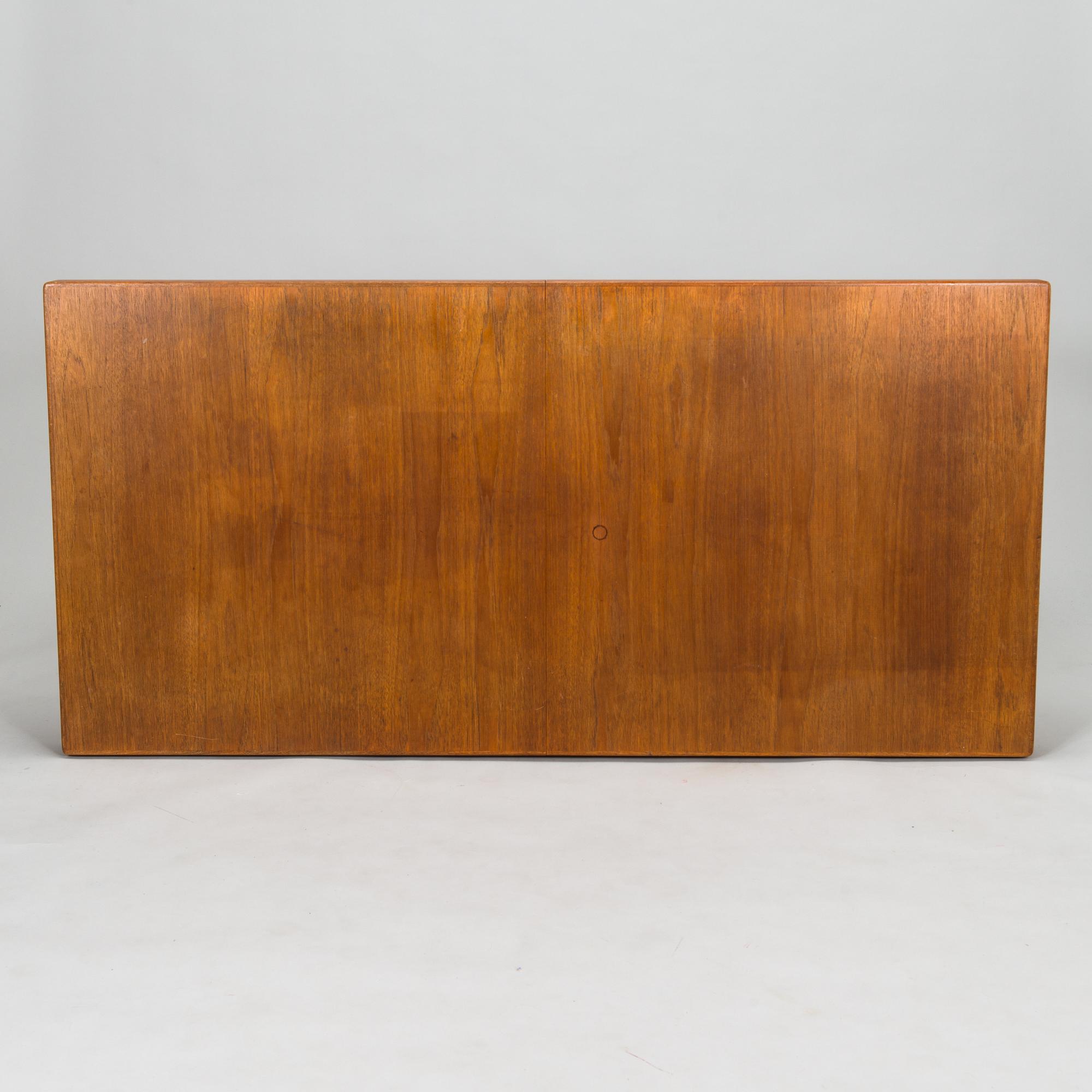 Carl Gustaf Hiort af Ornäs, a mid-20th Century dining table and eight chairs for  för HMN Huonekalu Mikko Nupponen.