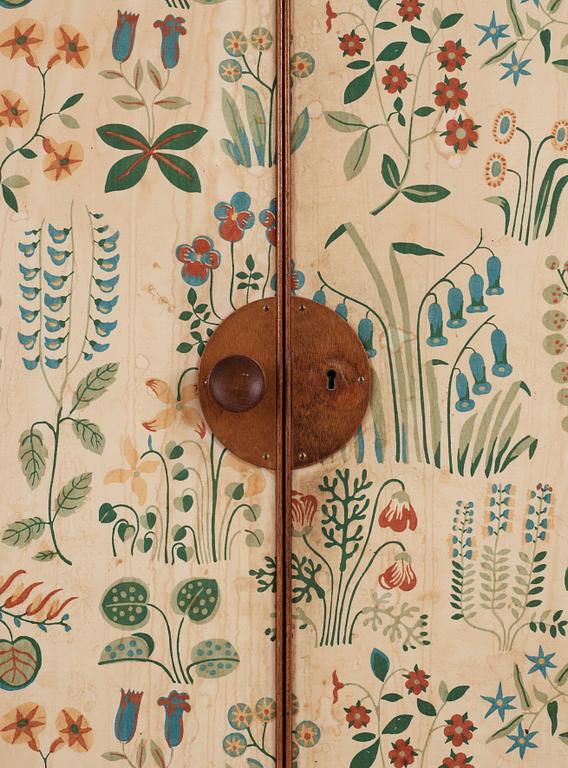 A Josef Frank mahogany cabinet, doors and sides covered in Frank's floral chintz fabric 'Fatima', Svenskt Tenn ca 1937.