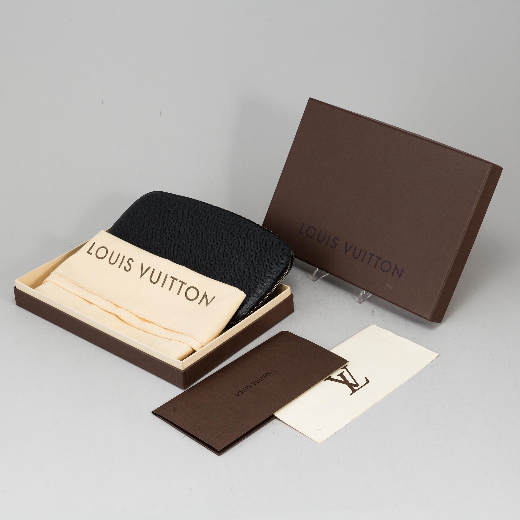 LOUIS VUITTON, an 'Atoll Ardiose' Taiga leather trave organizer, 2015.