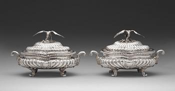 A pair of English mid 18th century silver tureens, marks of Frederick Kandler, London 1755.