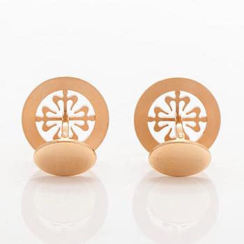 Patek Philippe, a pair of 18K gold "Calatrava" cufflinks.
