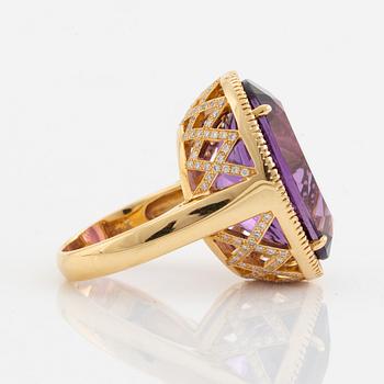 Oval faceted amethyst and brilliant cut diamond cocktail ring.