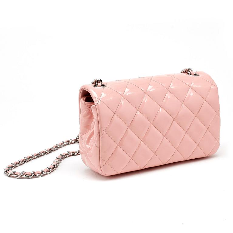 CHANEL, a mini pink quilted patent crossbody bag.