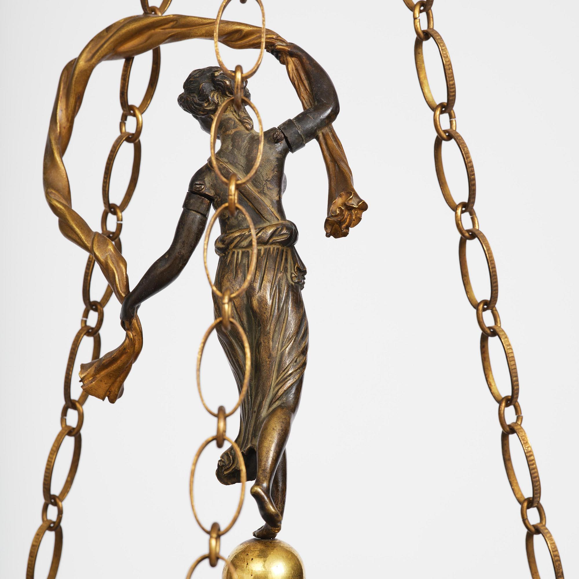 A patinated and ormolu six-light Empire chandelier, Stockholm, first part 19th century.